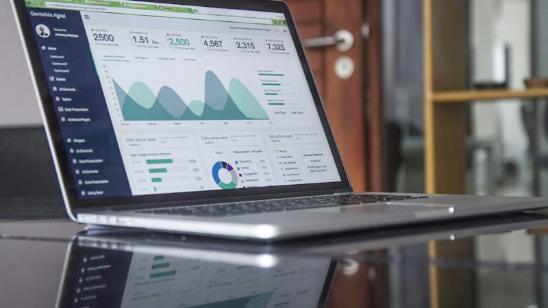 Travel consultant analyzing CRM lead conversion performance and agency metrics on a dashboard