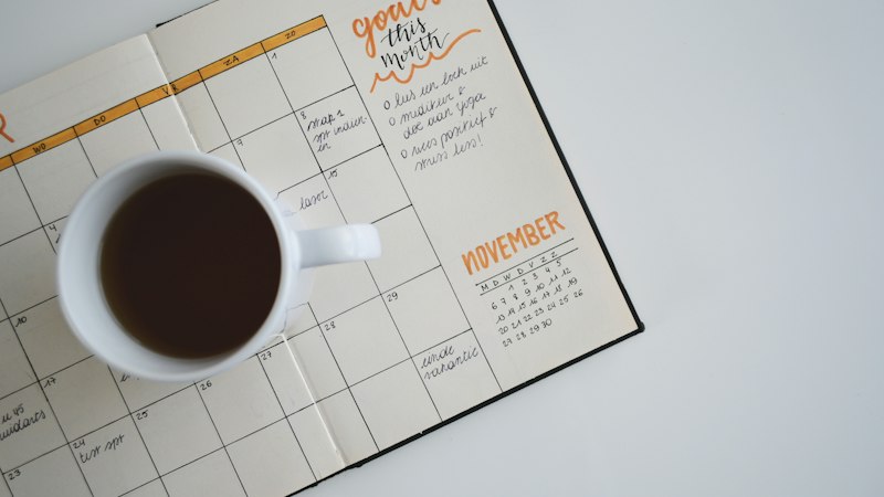 Organized calendar schedule planner and timeline management on a clean professional desk